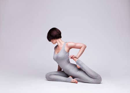 young beautiful woman yoga posingの写真素材