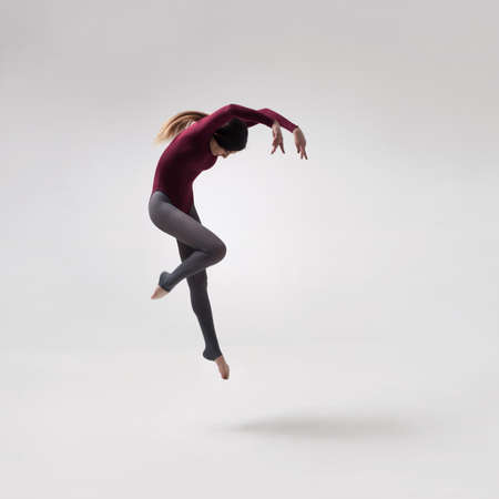 young woman dancer in maroon swimsuit posingの写真素材