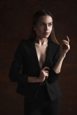 portrait young elegant woman in black jacketの写真素材
