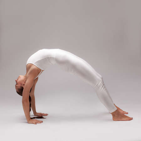 young beautiful woman yoga posing. isolatedの写真素材
