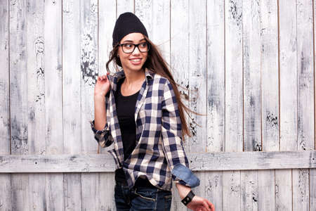 Hipster girl in glasses and black beanieの写真素材