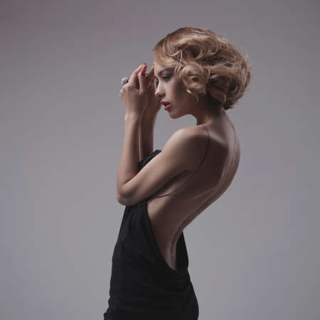 beautiful woman model posing in elegant dressの写真素材