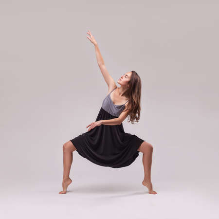 young beautiful woman dancer posing