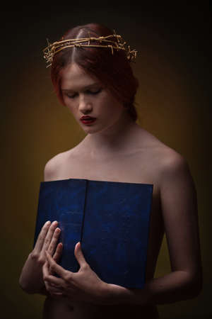 young beautiful woman with red hair posingの写真素材