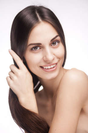 Beautiful smiling woman with long straight hairの写真素材