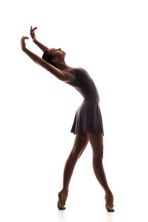 silhouette of young beautiful dancer isolatedの写真素材