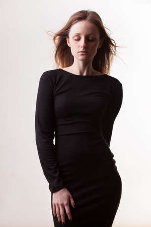 studio portrait of freckled woman without makeupの写真素材