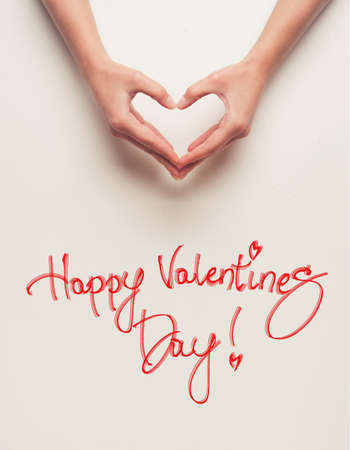 man and woman hands shows heart gestureの写真素材