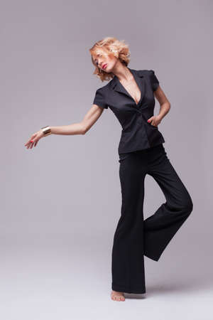 Fashion photo of woman in black suitの写真素材