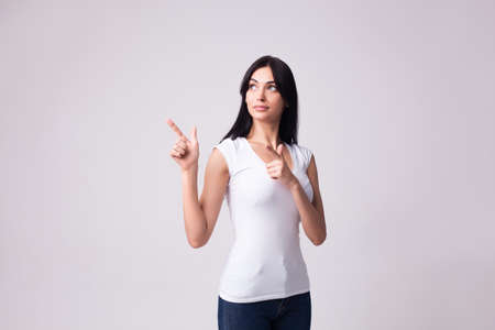 brunette woman gesturing with fingersの写真素材