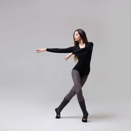 young beautiful dancer in black swimsuitの写真素材