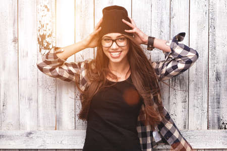 Hipster girl in glasses and black beanieの写真素材