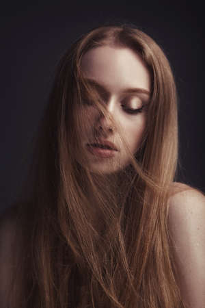 beautiful elegant woman with long straight hairの写真素材