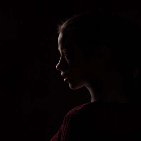 female silhouette isolated on black backgroundの写真素材