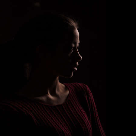 female silhouette isolated on black background