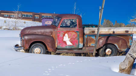 Old Pickup Truck In Snowの写真素材