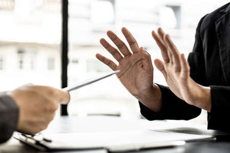 The businesswoman raised her hand to deny this conscience, she did not sign and accept money for participating in the upcoming large-scale corruption scheme, bribing was illegal and immoral.の写真素材
