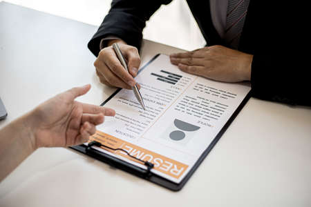 Female job seekers are presenting their information to job interviewers. The applicant presents her personal information, abilities and professional skills in order to be selected for the job.の写真素材