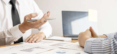 Finance staff are presenting financial information to finance managers by documenting charts, providing financial information to plan and develop the company's finances to grow. Financial concept.の写真素材