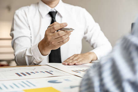 Finance staff are presenting financial information to finance managers by documenting charts, providing financial information to plan and develop the company's finances to grow. Financial concept.の写真素材