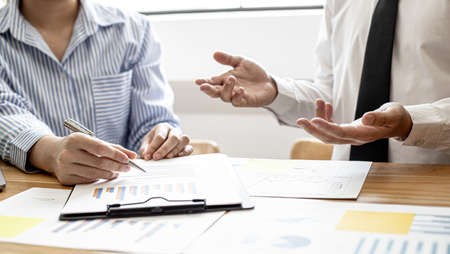 The finance department is presenting company financial information to executives and meeting attendees at the big monthly meetings, to summarize the company's performance. Financial concept.の写真素材