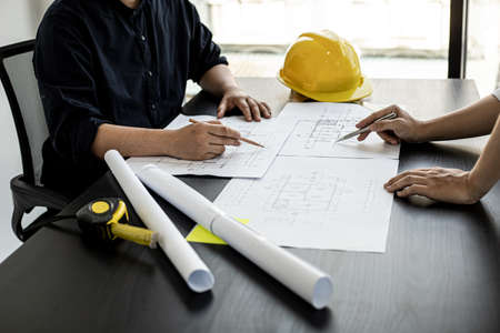 Architects and engineers are working together to edit the draft house plan that was designed after it was presented to the client and partially revised the design. Interior design and decoration ideasの写真素材