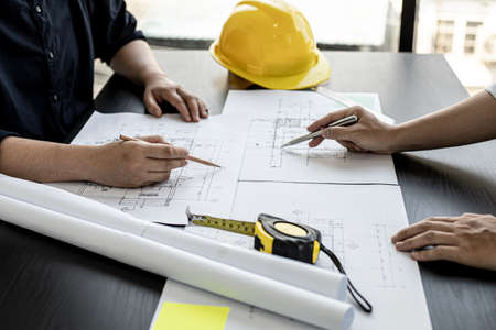 Architects and engineers are working together to edit the draft house plan that was designed after it was presented to the client and partially revised the design. Interior design and decoration ideasの写真素材