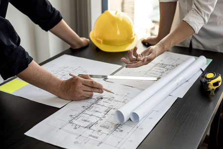 The architects and engineers are meeting to discuss building plans, big projects that can be auctioned. Interior design and decoration ideas.の写真素材