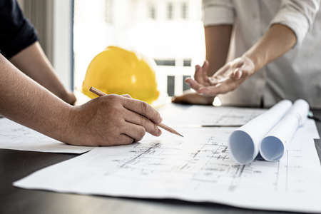 The architects and engineers are meeting to discuss building plans, big projects that can be auctioned. Interior design and decoration ideas.の写真素材