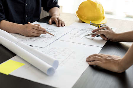 Architects and engineers are working together to edit the draft house plan that was designed after it was presented to the client and partially revised the design. Interior design and decoration ideasの写真素材
