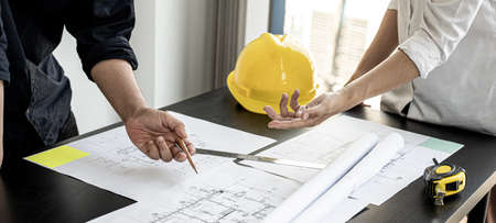 The architects and engineers are meeting to discuss building plans, big projects that can be auctioned. Interior design and decoration ideas.の写真素材