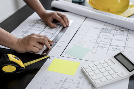 Home design architects are editing the drafts of the house plans, a project that was commissioned by clients and designed according to the requirements prior to delivery. Interior design ideas.の写真素材