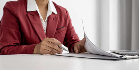 Recruiting people to work in the company vacancies, recruiting employees to work in the vacancy, qualifying by job position and interviewing by department manager. The manager is reviewing the resume.の写真素材