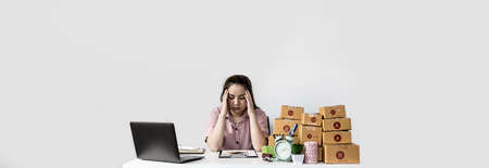 The owner of the Start Up Company is having anxious symptoms. Because there is adecrease in the amount of orders from the previous month, making the goods outstanding. Sales management. copy space.の写真素材