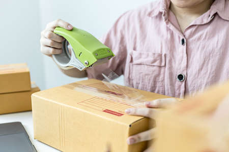 Employees are packing products according to orders from customers on the online website. And forward...