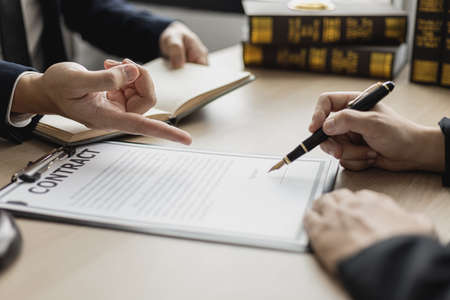 Attorneys or lawyers are advising clients in defamation cases, they are collecting evidence to bring charges against the parties for damages. The concept of defamation case counseling.の写真素材
