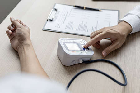 The doctor shows a document informing the results of the examination, the doctor explains the...