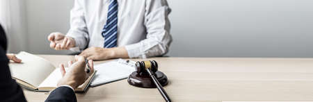 Attorneys or lawyers are advising clients in defamation cases, they are collecting evidence to bring charges against the parties for damages. The concept of defamation case counseling. copy space.の写真素材