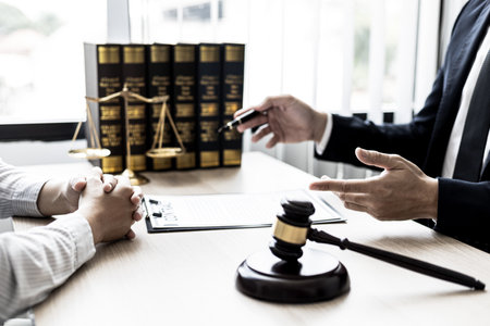 counseling lawyer And check the documentary evidence together, which the client has filed a lawsuit against employees in the company that commit fraud. The concept of litigation counseling.の写真素材