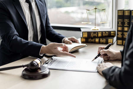 Attorneys or lawyers are advising clients in defamation cases, they are collecting evidence to bring charges against the parties for damages. The concept of defamation case counseling.の写真素材