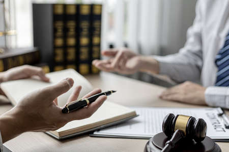 Attorneys or lawyers are advising clients in defamation cases, they are collecting evidence to bring charges against the parties for damages. The concept of defamation case counseling.の写真素材