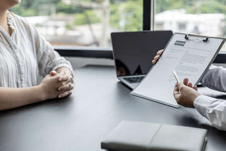 HR review candidate resumes for open positions, HR has a preliminary interview from applicants before selecting for an interview with managers. The concept of personnel allocation to work.の写真素材