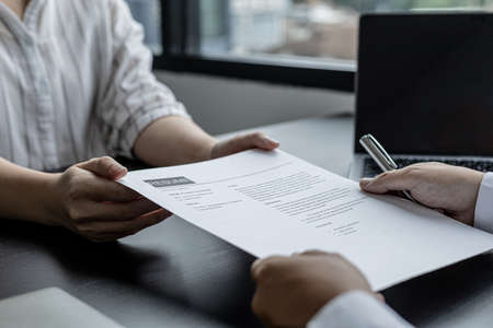Applicants submit resumes to managers for job interviews, the resume should contain important information about themselves to make it easier to get a chance to be considered for a job offer.の写真素材