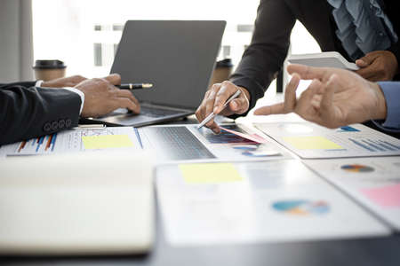 Executives and managers are meeting in a conference room, on the table there are some documents about the company's finances, managers are discussing financial information with the management.の写真素材
