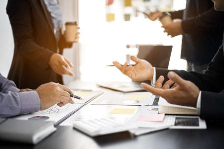 The atmosphere in the conference room was attended by four businessmen, a joint company operating...