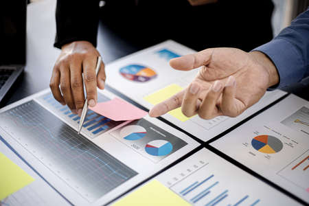 Executives and managers are meeting in a conference room, on the table there are some documents about the company's finances, managers are discussing financial information with the management.の写真素材