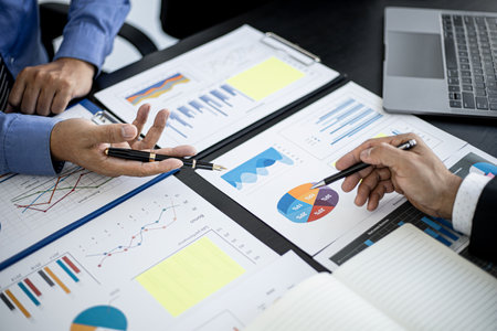 Atmosphere in a meeting room with two businessmen meeting together brainstorming on the operation of the company together for business growth. business management concept.の写真素材