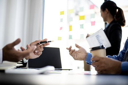 The atmosphere in the meeting room where businessmen and business partners are meeting together, meeting summaries and brainstorming to make the company grow more. Concept of business administration.の写真素材