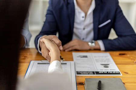Managers and job applicants shake hands after the job interview, job interviews to find people to work with the company and talent to work with. Concept of recruitment and job interviews.の写真素材