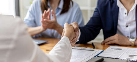 Managers and job applicants shake hands after the job interview, job interviews to find people to work with the company and talent to work with. Concept of recruitment and job interviews.の写真素材